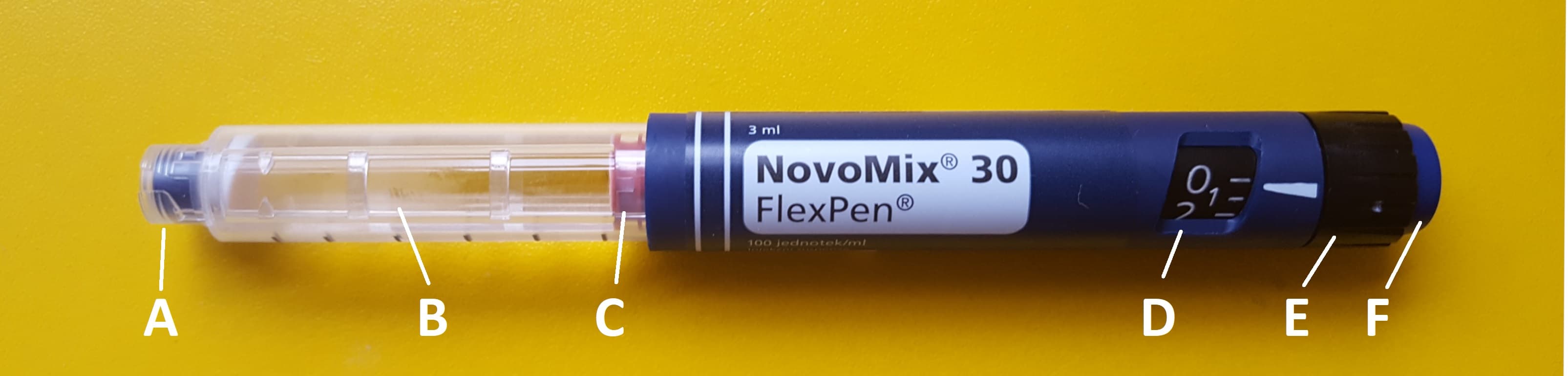 Labeled insulin pen on a neutral background