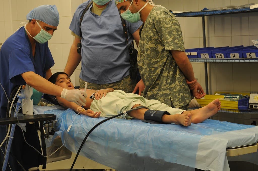 Doctor consulting adult patient in a hospital setting
