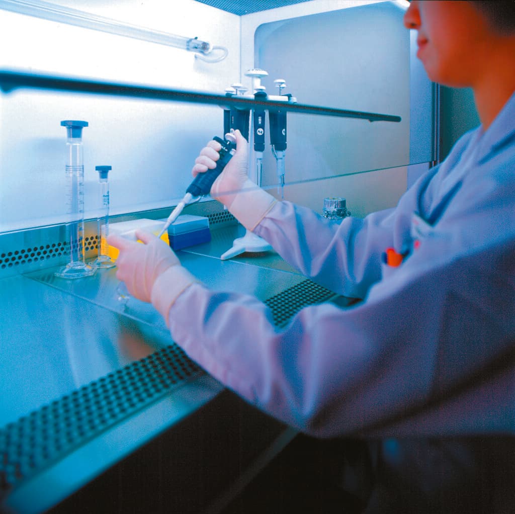 Laboratory scene showing stem cell transplant work with scientists and equipment